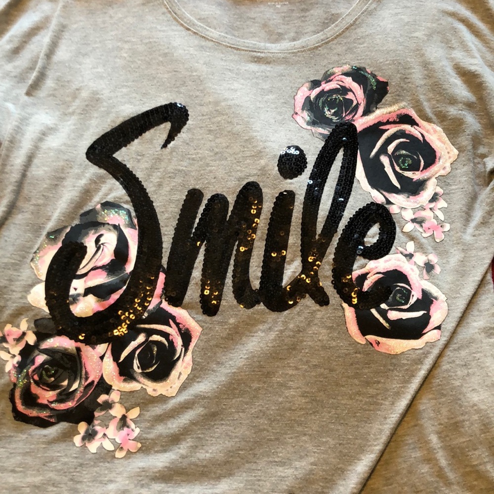 Sequin and glitter “smile” top